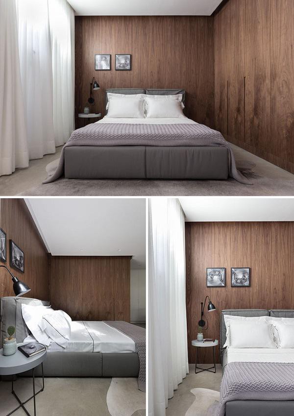 Phòng ngủ ớ phía bên đối diện với cách phòng khách, bao quanh bởi những bức tường gỗ hiện đại.