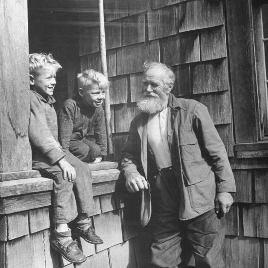 old-man-talking-to-two-young-boys_u-l-p75x5t0