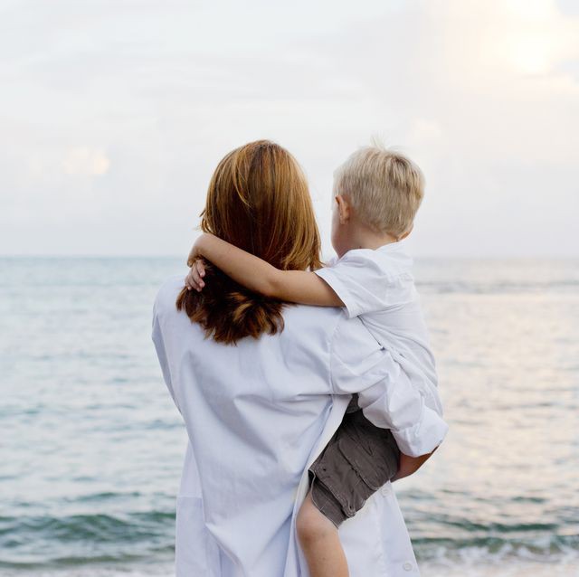 mother-and-son-admiring-ocean-royalty-free-image-592014719-1556290551