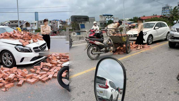 Mercedes trắng tinh khôi bị hàng trăm viên gạch ụp vào đầu, chủ xe đứng thất thần giữa phố đông - Ảnh 1.