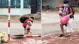 Bé trai "cắp nách" em nhỏ đi vào khu điều trị, cha mẹ F0 đều đã đi cách ly: Đừng khóc, có anh ở đây rồi!